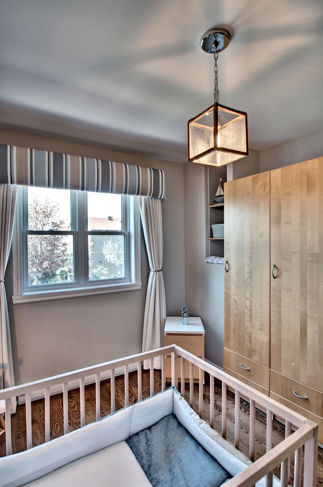 Example of a small beach style boy nursery design in Montreal
