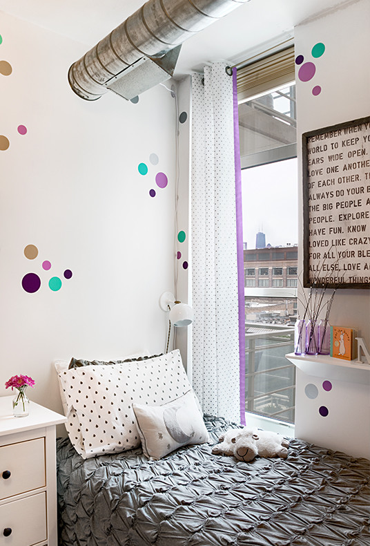 Example of a mid-sized minimalist girl carpeted and purple floor nursery design in Chicago with purple walls