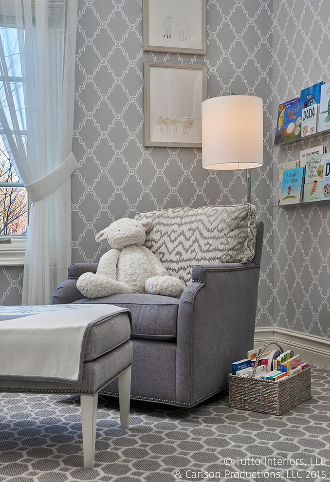 This is an example of a medium sized classic nursery for boys in Detroit with grey walls and carpet.
