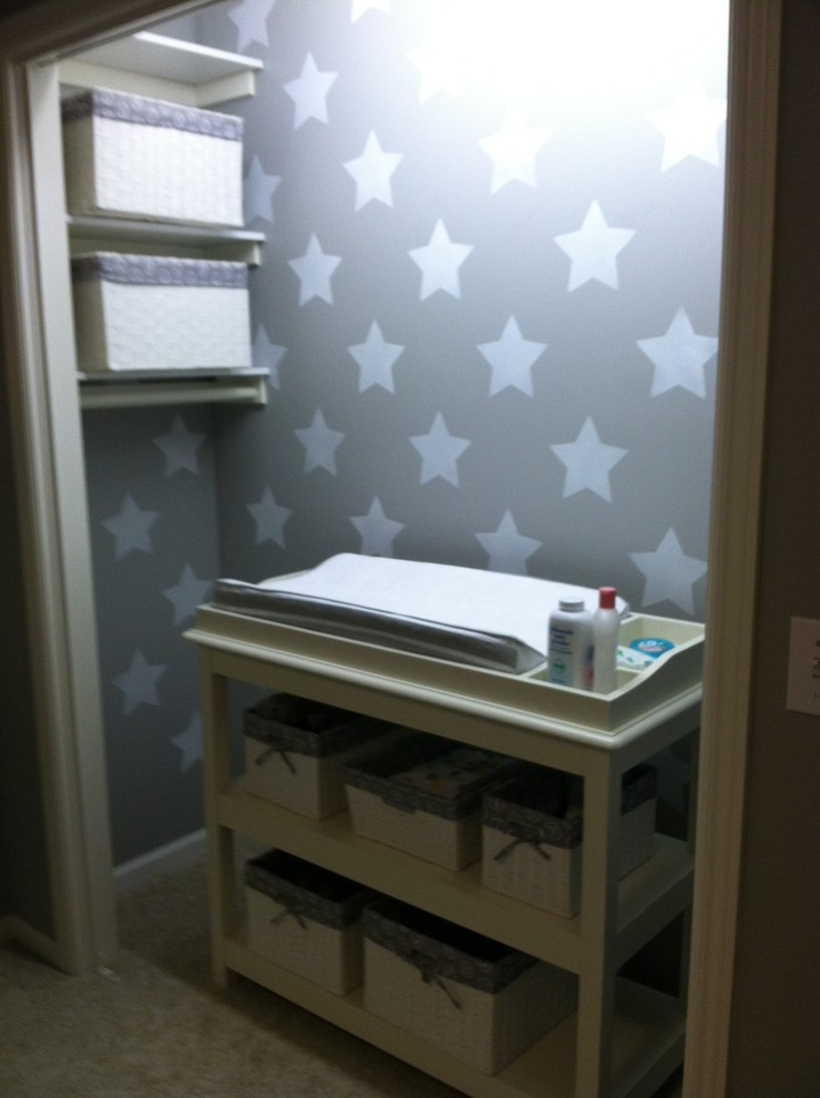 Example of a small transitional gender-neutral carpeted nursery design in Grand Rapids with gray walls