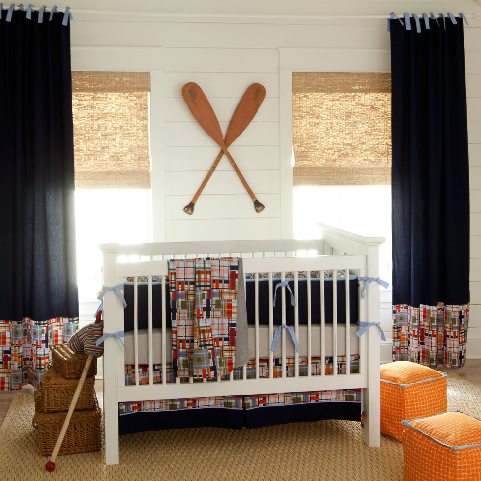 Design ideas for a beach style nursery for boys in Atlanta with white walls.