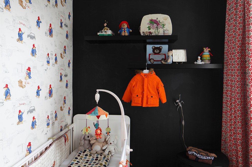 Contemporary nursery for boys in London with multi-coloured walls.