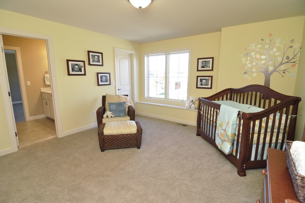 Nursery - large craftsman carpeted nursery idea in Minneapolis with yellow walls