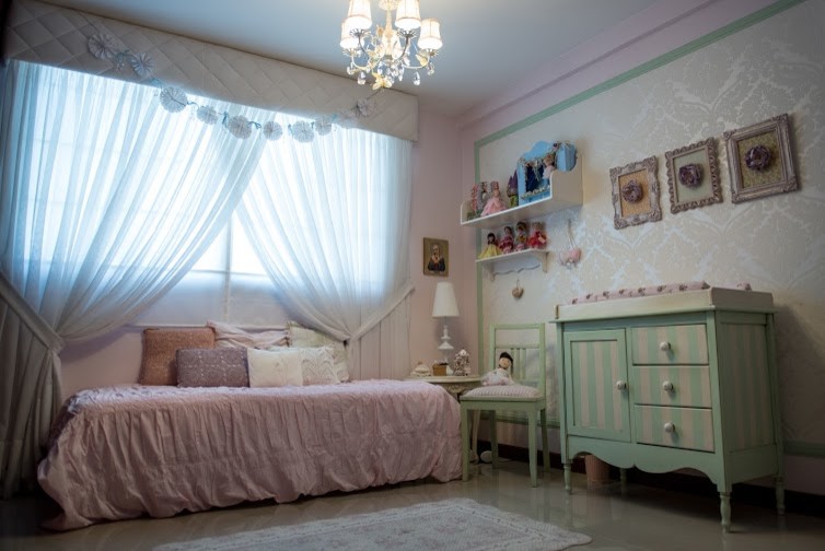 Mid-sized eclectic girl nursery photo in Miami with beige walls