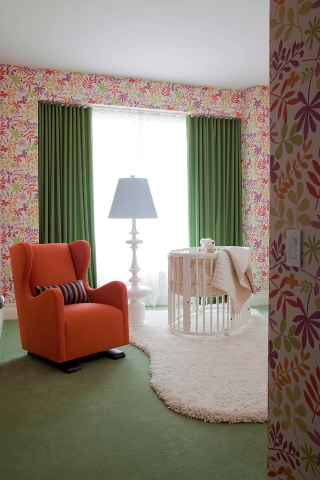 Inspiration for a contemporary nursery for girls in New York with multi-coloured walls, carpet and green floors.