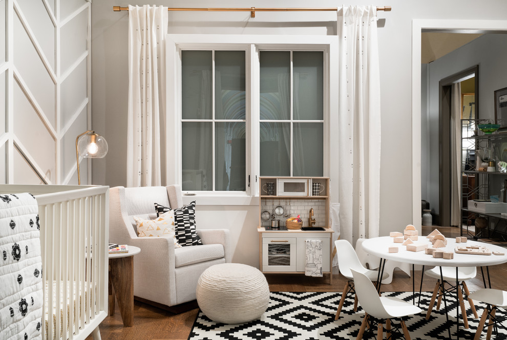 На фото: нейтральная комната для малыша среднего размера в стиле ретро с серыми стенами, паркетным полом среднего тона и коричневым полом с