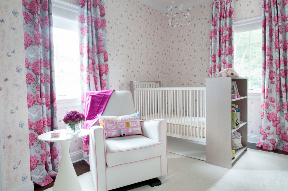 This is an example of a traditional nursery for girls in New York with multi-coloured walls and white floors.