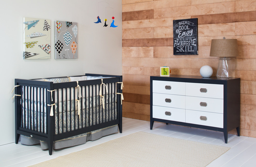 Medium sized modern nursery for boys in Orange County with grey walls and vinyl flooring.