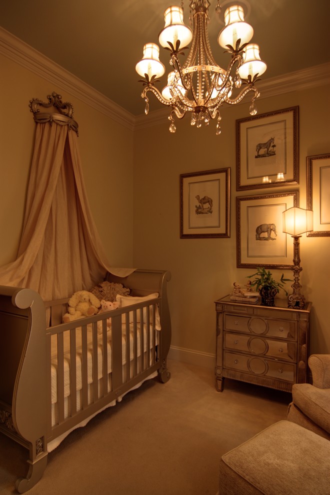 Inspiration for a mid-sized contemporary girl carpeted nursery remodel in New Orleans with beige walls