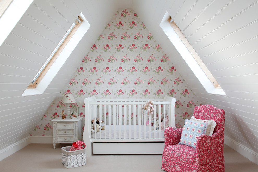 Traditional nursery for girls in Kent with multi-coloured walls, carpet and beige floors.