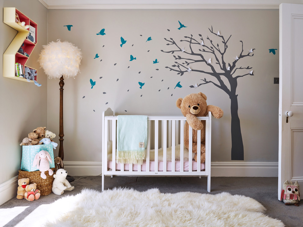 Medium sized classic nursery for girls in Other with grey walls, carpet, grey floors and a feature wall.