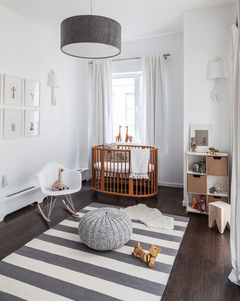 Inspiration for a mid-sized transitional gender-neutral dark wood floor nursery remodel in New York with white walls