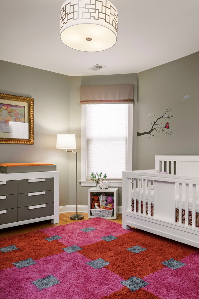 На фото: нейтральная комната для малыша среднего размера в стиле неоклассика (современная классика) с серыми стенами и паркетным полом среднего тона