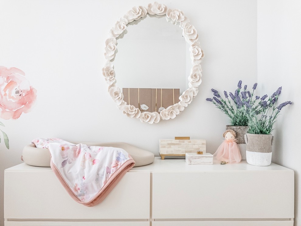 Inspiration for a medium sized traditional nursery for girls in New York with white walls, bamboo flooring and brown floors.