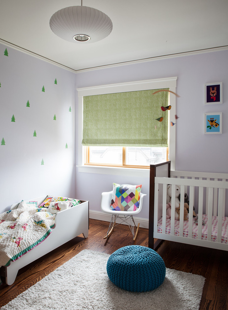 Design ideas for a medium sized contemporary nursery for girls in San Francisco with purple walls and dark hardwood flooring.