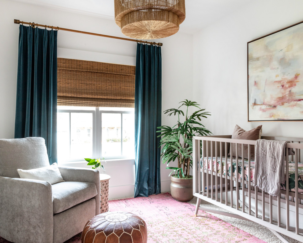 Classic nursery for girls in Charlotte with white walls, carpet and white floors.