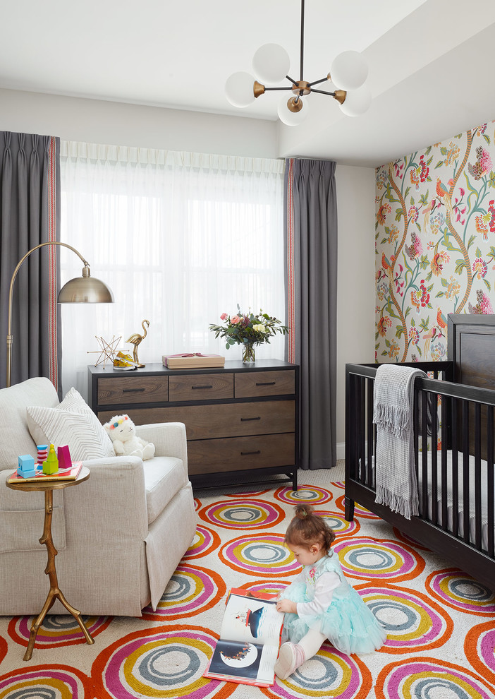 Inspiration for a mid-sized modern girl carpeted and beige floor nursery remodel in Chicago with multicolored walls