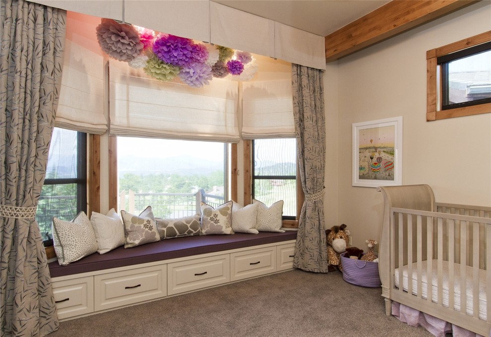 Traditional nursery for girls in Denver with beige walls, carpet and grey floors.