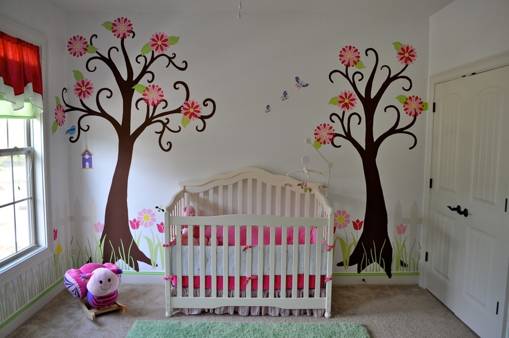 This is an example of a large contemporary nursery for girls in Raleigh with white walls and carpet.