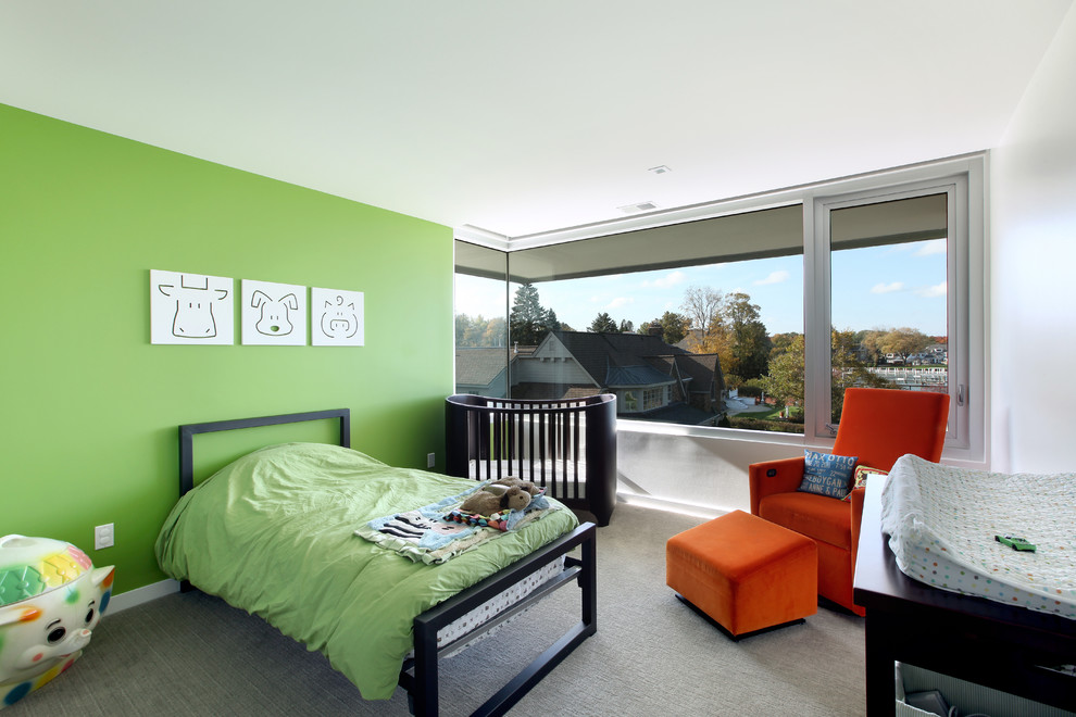 Example of a trendy boy carpeted and gray floor nursery design in Detroit with green walls