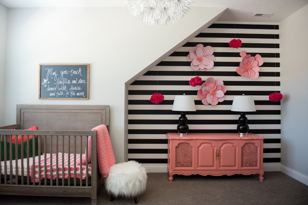 Example of a mid-sized trendy gender-neutral carpeted nursery design in Indianapolis with multicolored walls