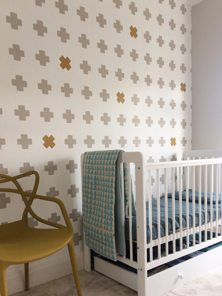Design ideas for a scandi gender neutral nursery in London with carpet and grey floors.