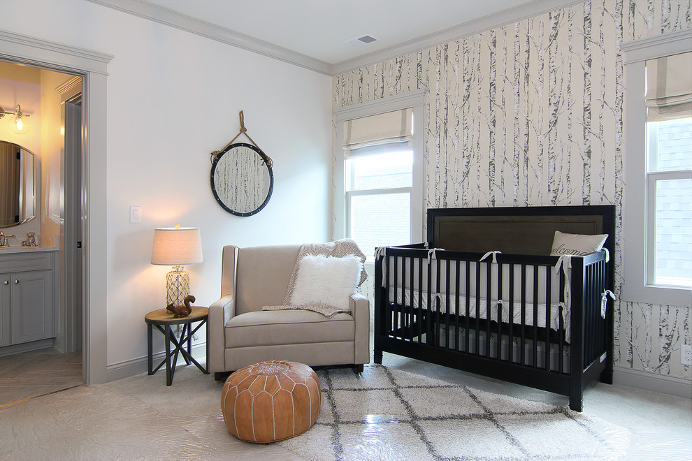 This is an example of a medium sized bohemian nursery for boys in Louisville with white walls and carpet.