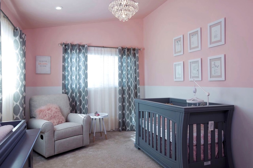 Vintage nursery for girls in San Diego with pink walls and carpet.