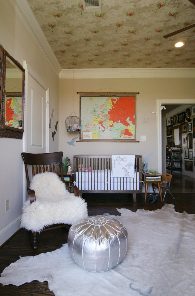 Nursery - eclectic gender-neutral dark wood floor nursery idea in Dallas with beige walls