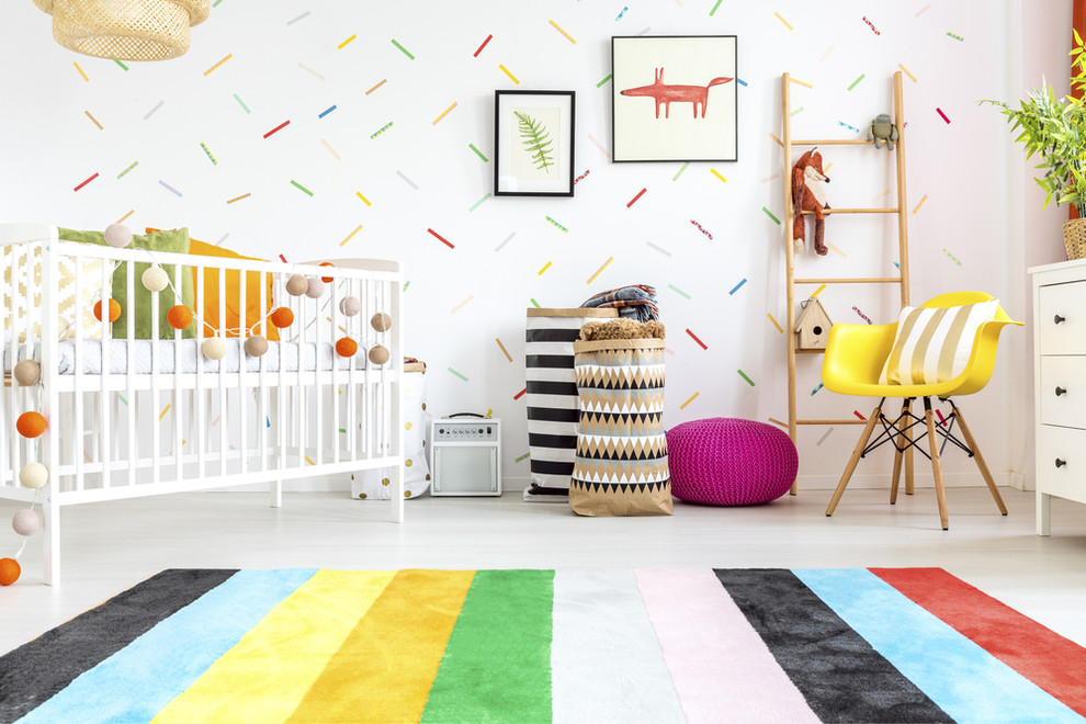 Photo of a medium sized bohemian gender neutral nursery in Adelaide with white walls, concrete flooring and white floors.