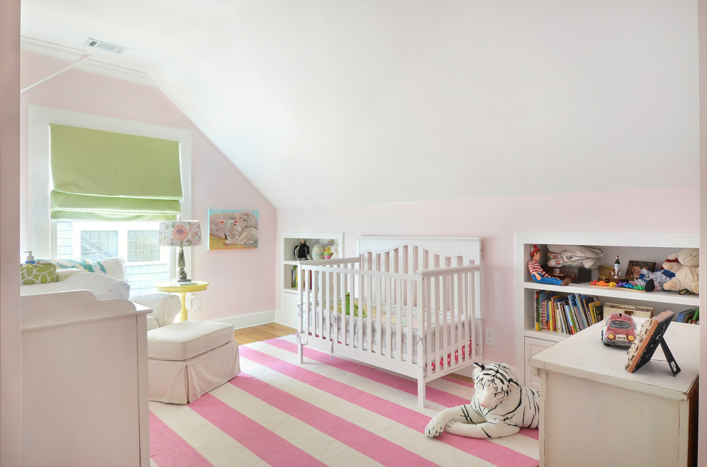 Nursery - traditional girl pink floor nursery idea in Atlanta with pink walls