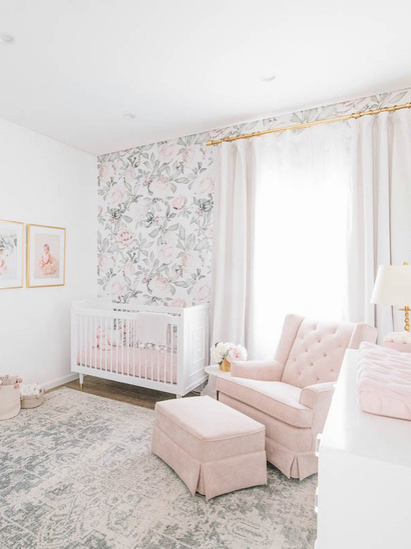 Photo of a medium sized traditional nursery for girls in Los Angeles with white walls.