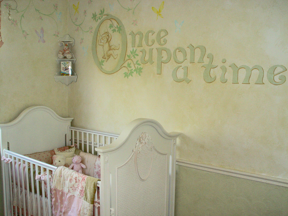 This is an example of a medium sized classic nursery for girls in Los Angeles with multi-coloured walls, carpet and a dado rail.