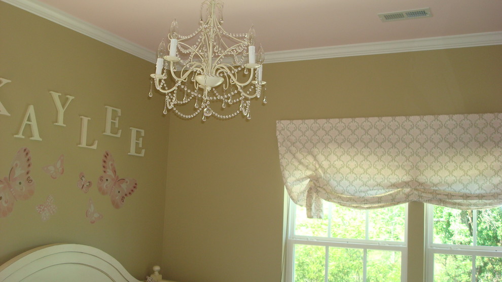 Inspiration for a medium sized traditional nursery for girls in Charlotte with beige walls.