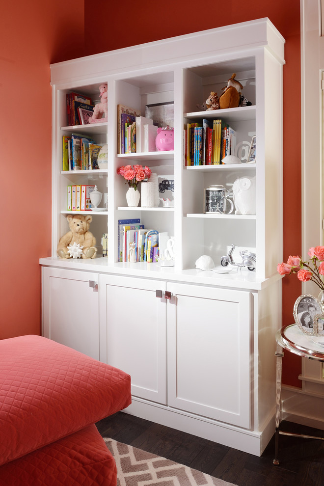 This is an example of a medium sized traditional nursery for girls in Other with medium hardwood flooring.