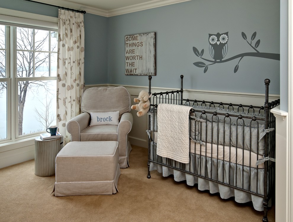 Example of a classic gender-neutral carpeted nursery design in Minneapolis with blue walls