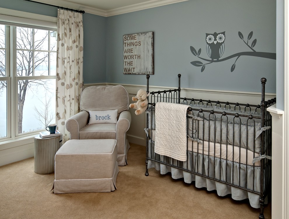 Example of a classic gender-neutral carpeted nursery design in Minneapolis with blue walls