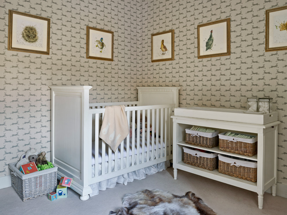 Design ideas for a medium sized classic gender neutral nursery in London with carpet, multi-coloured walls and beige floors.