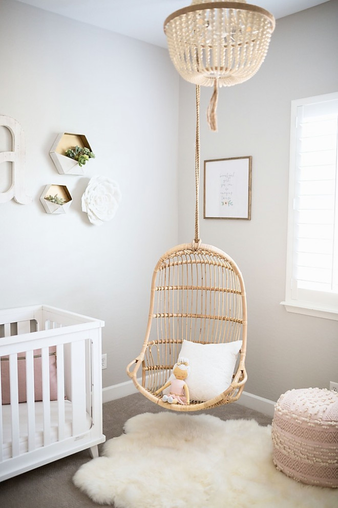 На фото: комната для малыша среднего размера в стиле шебби-шик с серыми стенами, ковровым покрытием и бежевым полом для девочки