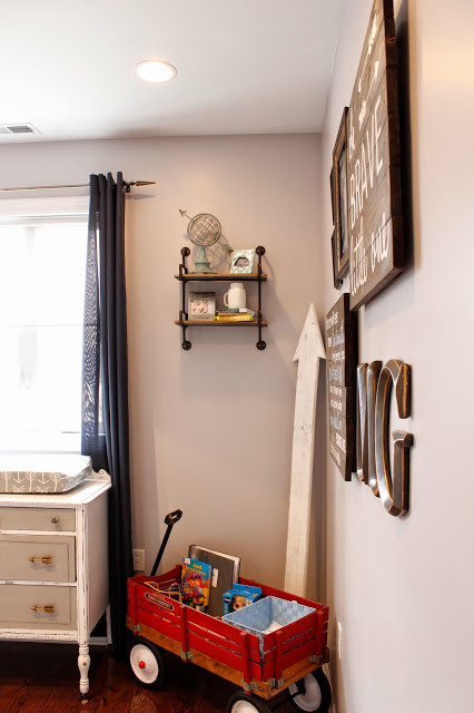 Inspiration for a medium sized rustic nursery for boys in Chicago with grey walls and medium hardwood flooring.