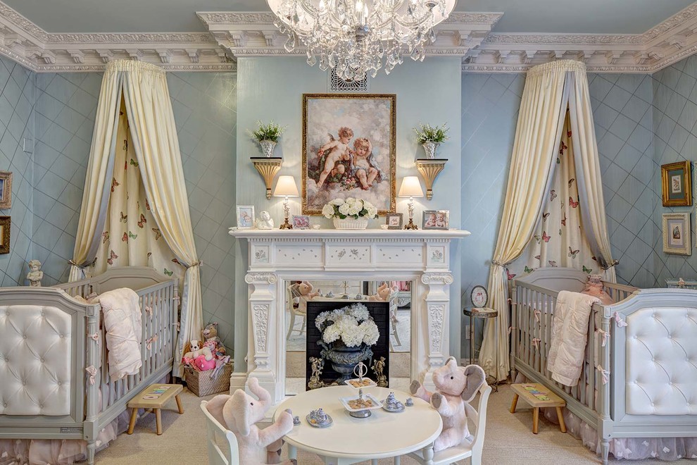 Design ideas for a large classic nursery for girls in New York with blue walls, carpet, beige floors and a chimney breast.