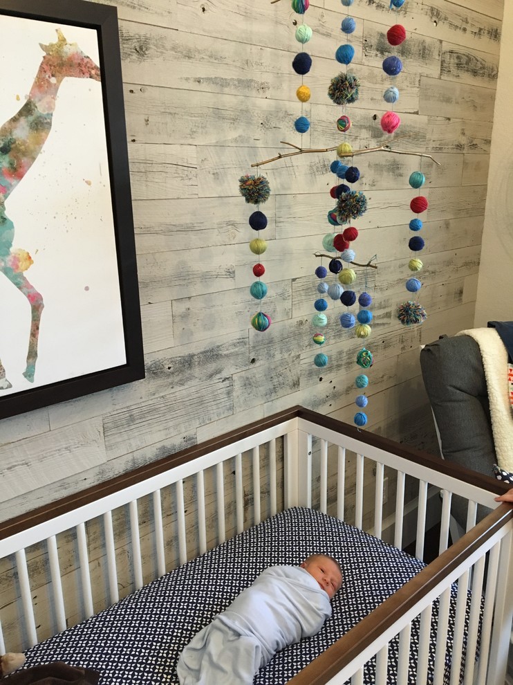 Inspiration for a medium sized eclectic nursery for boys in Miami with white walls and dark hardwood flooring.
