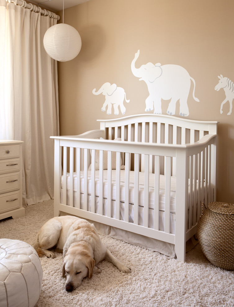 Inspiration for a transitional gender-neutral carpeted nursery remodel in Boise with beige walls