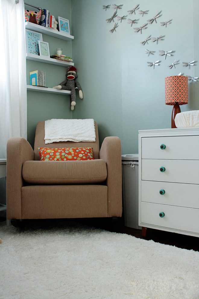 Nursery - transitional gender-neutral nursery idea in Other with blue walls