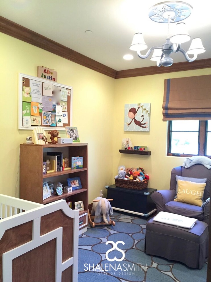 This is an example of a contemporary gender neutral nursery in Los Angeles with yellow walls and medium hardwood flooring.