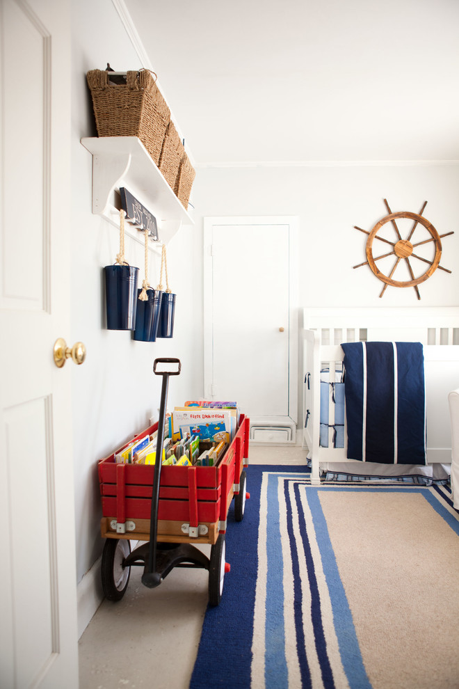 Beach style boy nursery photo in Boston with white walls