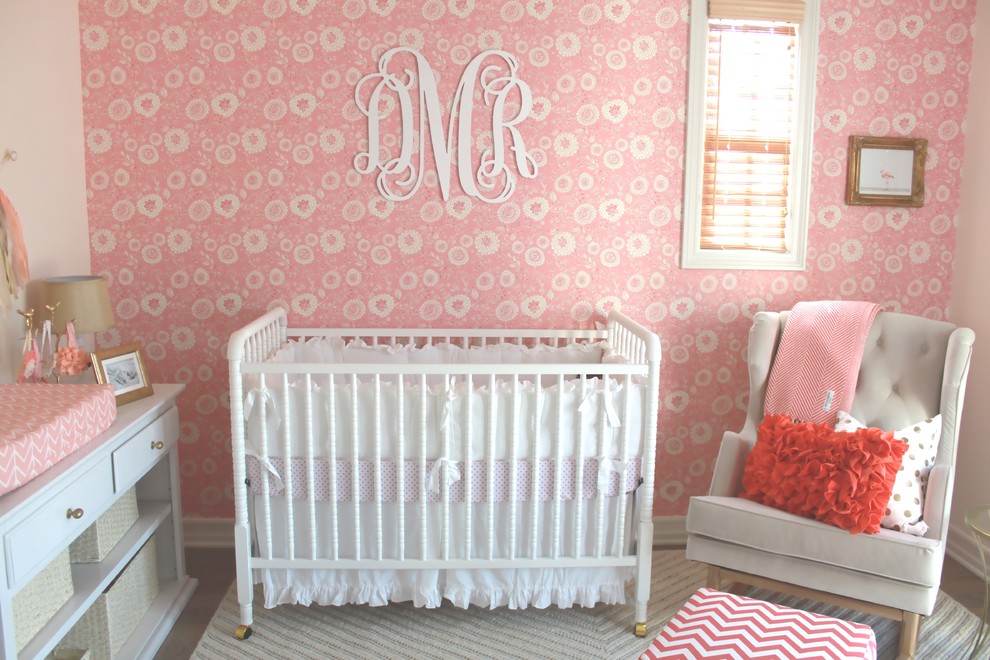 Medium sized classic nursery for girls in Orange County with pink walls and carpet.