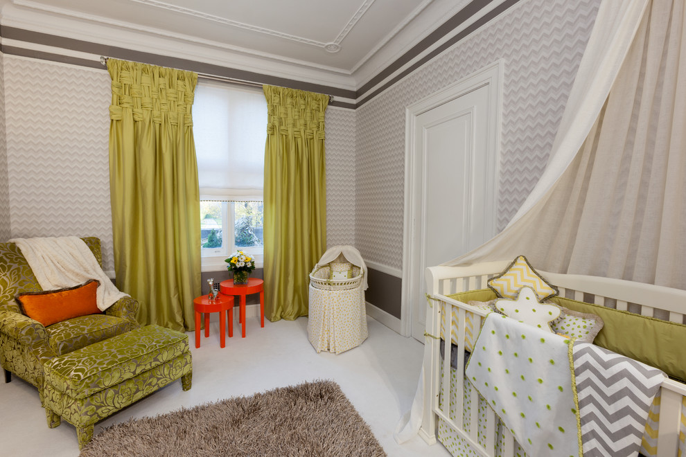Example of a mid-sized classic gender-neutral carpeted nursery design in New York with gray walls