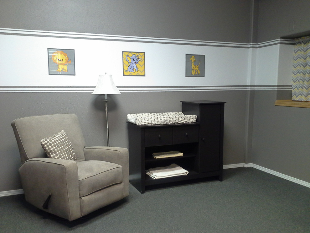 Example of a small trendy gender-neutral carpeted nursery design in Albuquerque with gray walls