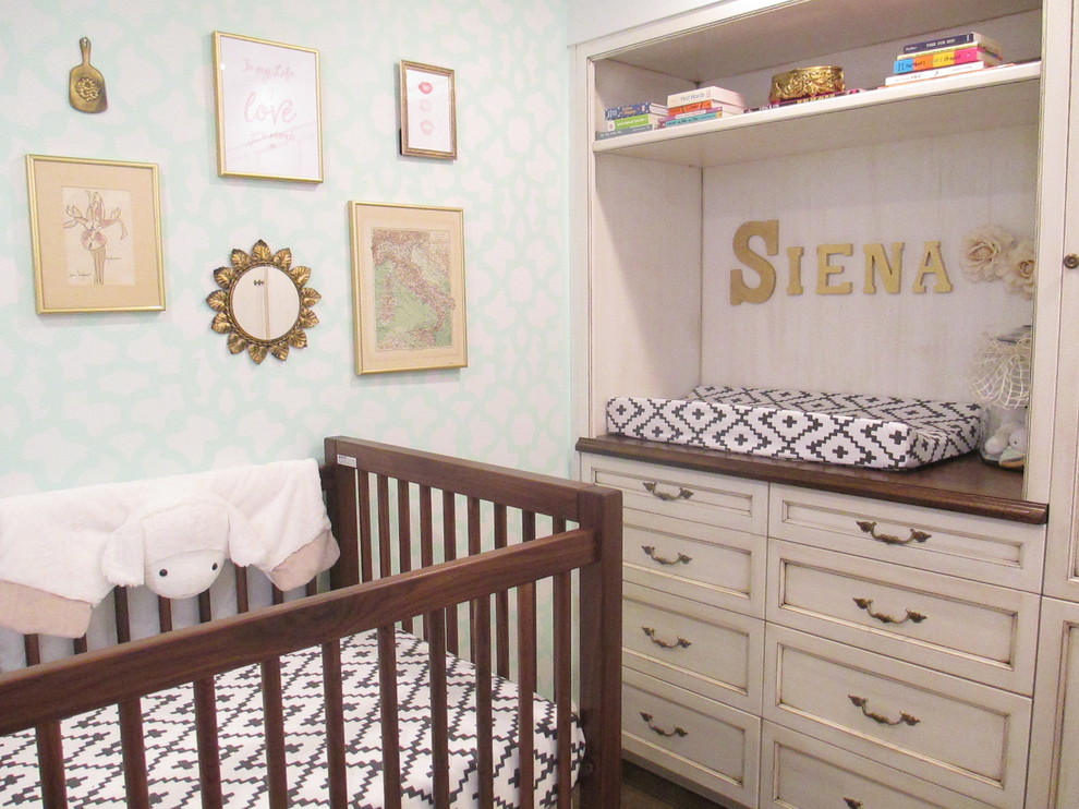 This is an example of a medium sized bohemian nursery for girls in New York with dark hardwood flooring and brown floors.